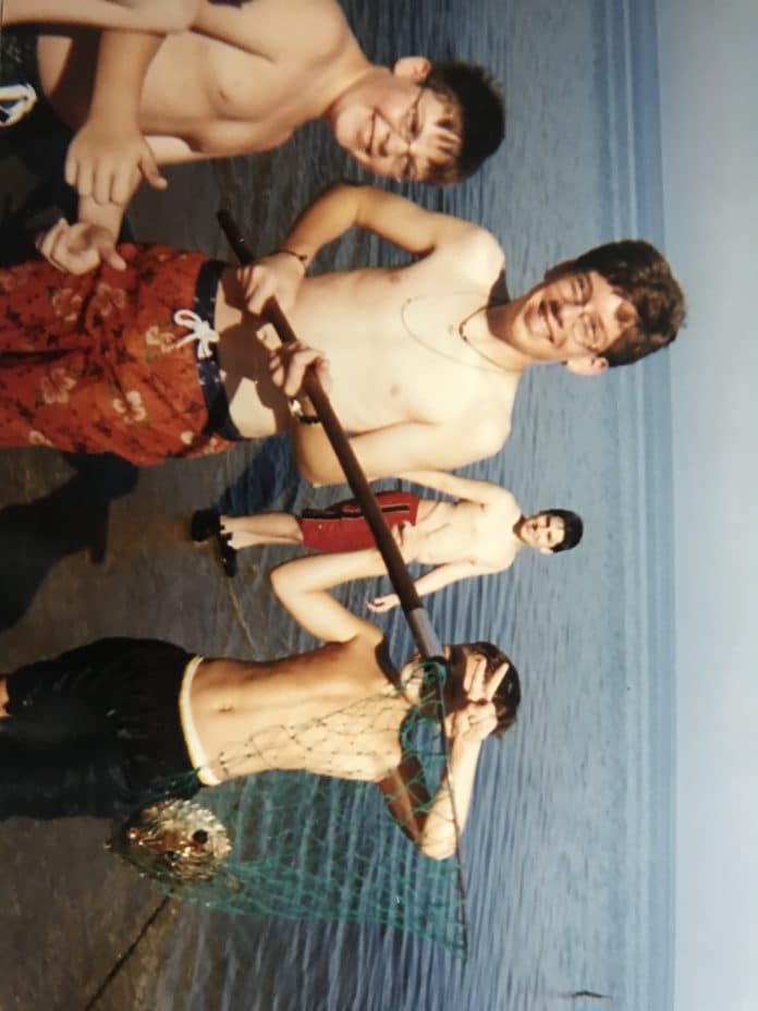 Troop 71 Scouts show off their catch during a fishing trip (approx. 1999)