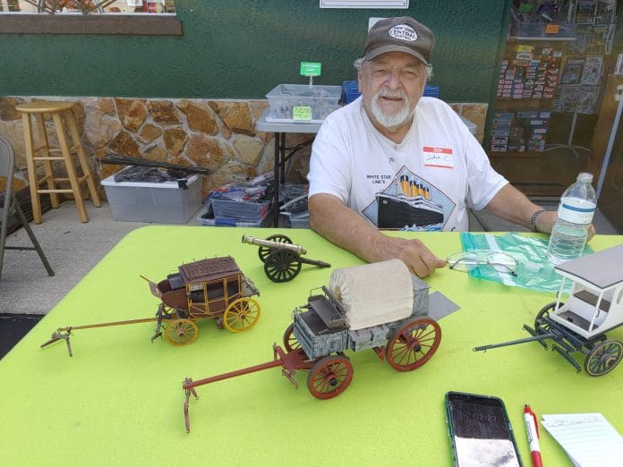 John Caiati with some of his models. The first one he built is on the far left.