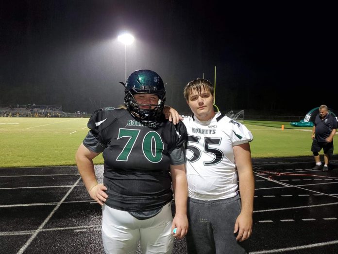 Mary Wilhelm (left) and her twin brother William (right) both play for the Weeki Wachee football team this year.