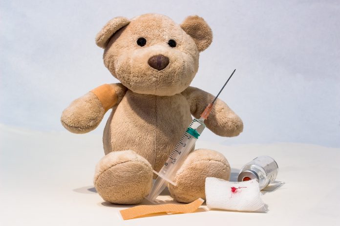teddy bear with a vaccine