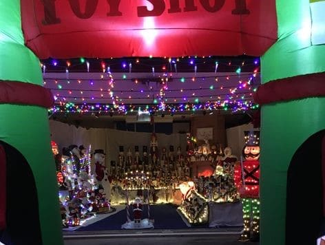 Two car garage display with nutcrackers and outside lights.  The address is 9444 Lakeview Ct Spring Hill 34606
