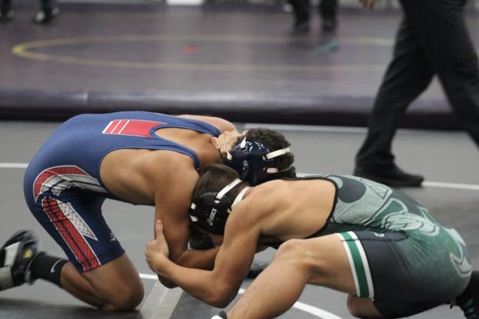 (132) Springstead's Anthony Freeman and Weeki Wachee's Addison Breeding fighting for control.