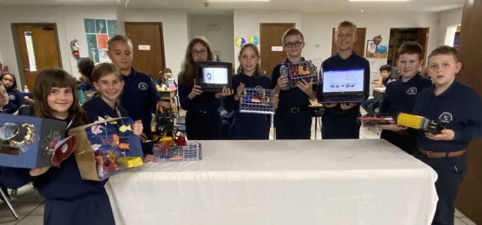 Upper elementary students with their Technology Day projects