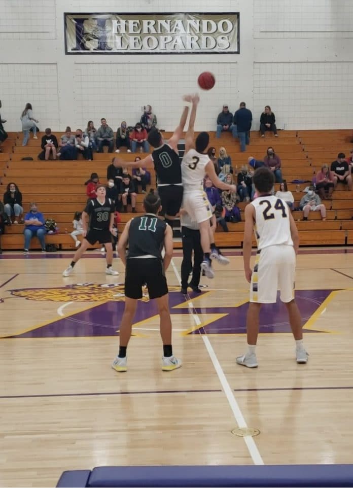 Jump ball between Weeki Wachee’s Kobe Bigger and Hernando’s Jacob Lape