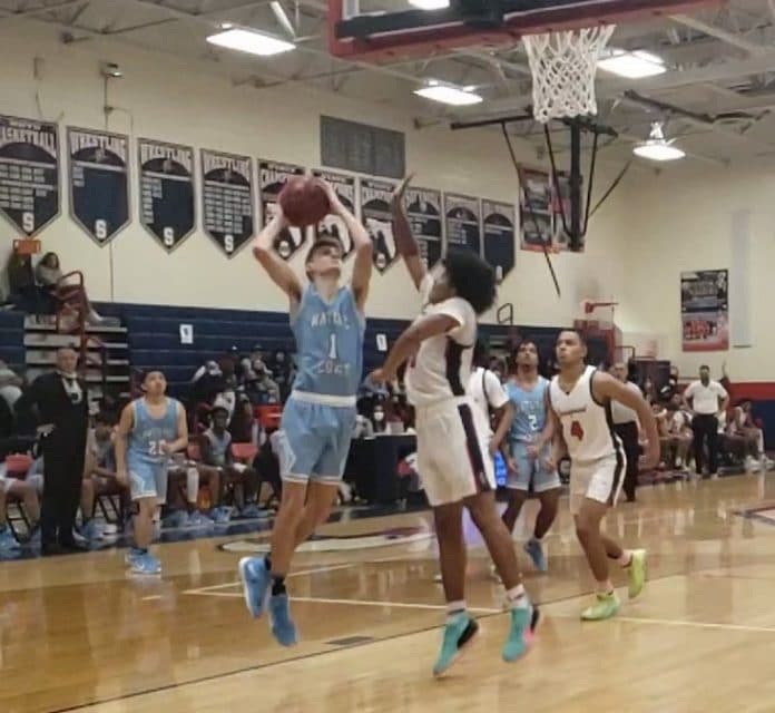 Nature Coast’s Justin Bunkelman attempts a shot over Springstead’s Saquon Carswell