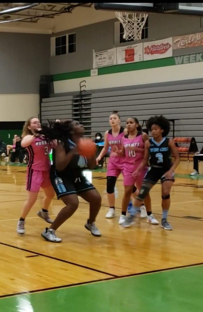 Heaven Lee secures a rebound and gets ready to score. Photo by Tim Gordon