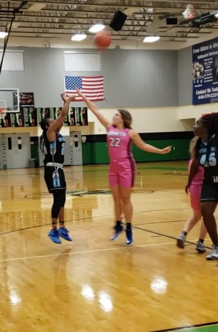 Zipporrah Charlson shoots over Weeki’s Cyd Rodriguez. Photo by Tim Gordon. Nature Coast Girls Basketball Making Strides