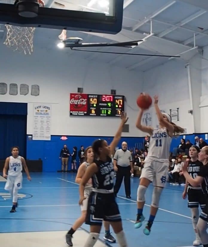 HCA's Lydia Jackson, sophomore, goes up for a shot. Photo courtesy of Mike Drummond.