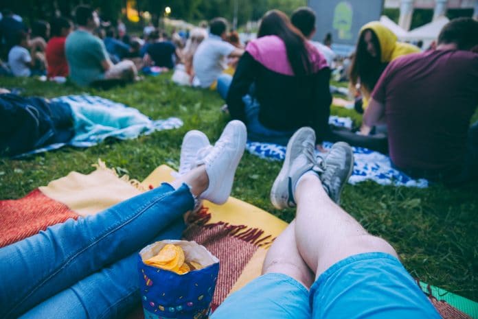 Laying on the grass watching movies