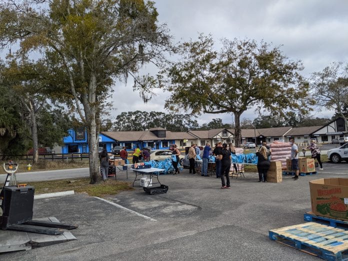 People Helping People volunteers operate the mobile-first food pantry at their facility, January 27, at 1396 Kass Cir, Spring Hill, Fla. Photo courtesy of Becky Burton.