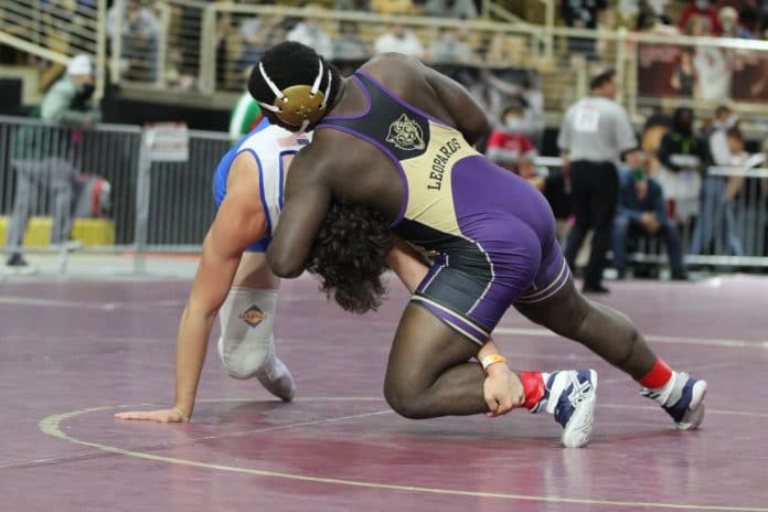 Hernando's Chris Spellman drives his opponent, Kolby Kidd from Fernandina Beach, is his match to secure a place on the podium. 