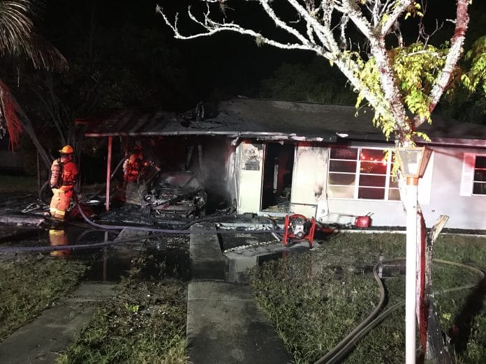 Fire under carport damages home