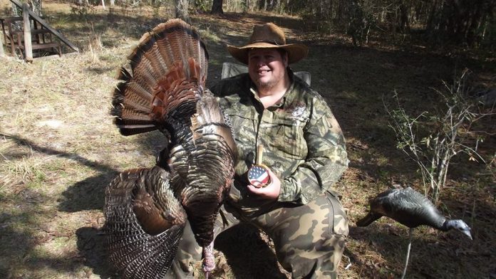 Toby with a trophy tom he called in with a homemade friction call.