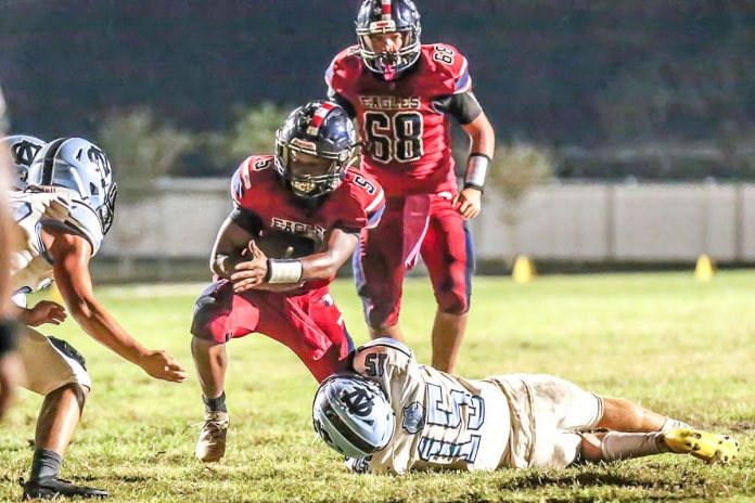 Friday night October 16, 2020 in the Eagles Nest, Eagle #5 Sr. Dante Young breaks free of tackle of Shark #15 So Brady Nowlan. Photo by Cherl Clanton, Hernando Sun.