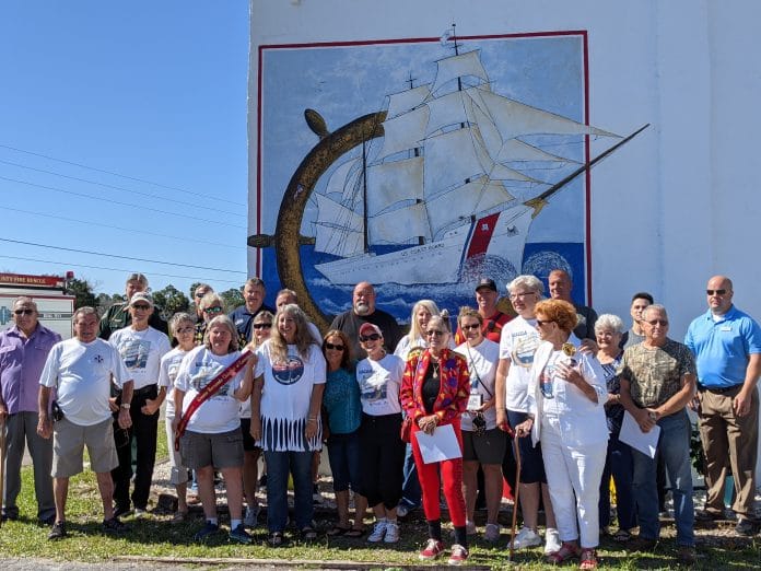 Attendees of the dedication ceremony in front of the new mural by Diane Liptak and Steve Krou