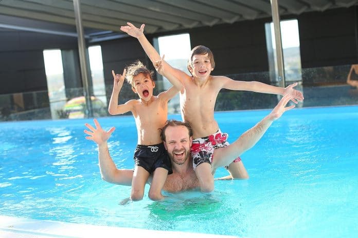 File photo of kids and adult in pool