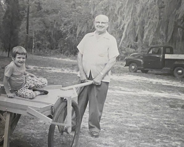 Judy at age 6 with Grandpa Mike.