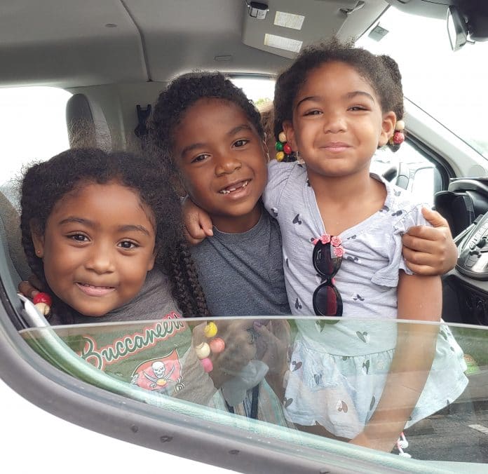 From left to right, Isabella, Gabriel & Emma Chabot eagerly pickup their backpacks at Nature Coast Technical High School's Back to School Bash on July 24, 2021. Photo by Sarah Nachin