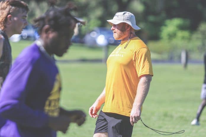 Leopards Head Coach Earl Garcia observes the players during a seven-on-seven practice. Photo by Alice Mary Herden