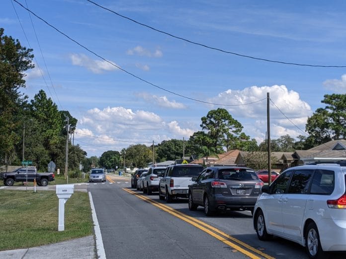 Pickup line at JD Floyd Elementary in Spring Hill. Cars are backed up onto Coronado.