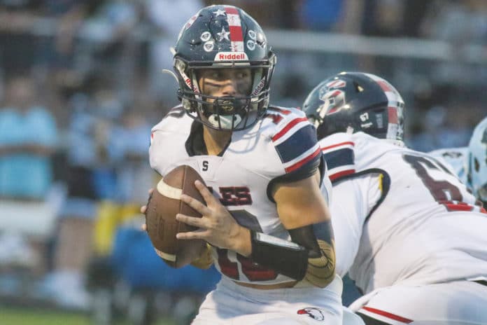 Eagles quarterback Nick Centola looks for an open player during the rival match against Nature Coast Tech earlier this season. Photo by Alice Mary Herden.