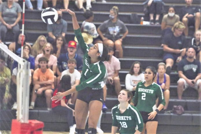 Hornets Danielle Mcgee (1) spikes the ball over the net during the volleyball match on Tuesday, Sept. 21, 2021, at Nature Coast Tech. Photo by Alice Mary Herden