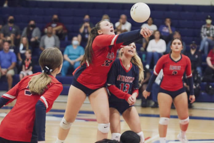 Sophomore Emily Miller (12) bumps the ball during the match against Lecanto on Sept. 20, 2021. Photo by Alice Mary Herden.