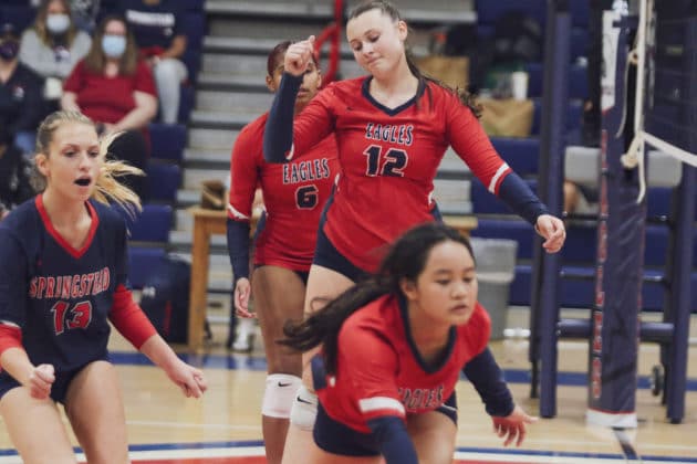 Sophomore Emily Miller (12) reacts to a point loss as Isabella Nunag (3) attempts to recover. Sept. 20, 2021, Photo by Alice Mary Herden.