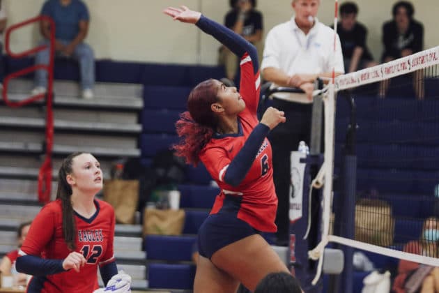 Junior Lynae James (6) jumps up for a spike during the match against Lecanto on Sept. 20, 2021. Photo by Alice Mary Herden.