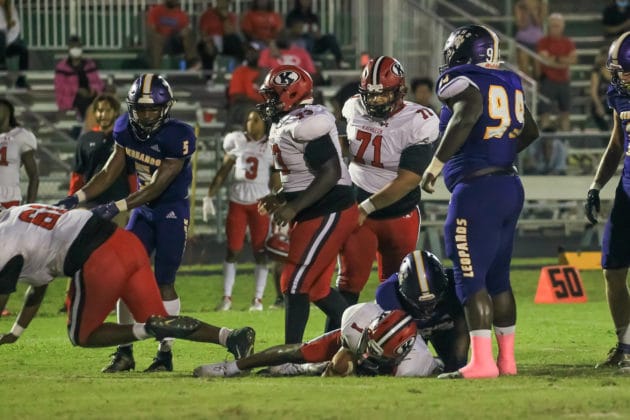 HHS's Brenden Mitchell takes down QB Shadarian Harrison from Kathleen. Photo by Scott LaPrade