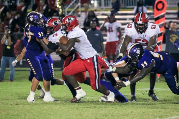 HHS Devin Williams gets his hand on QB Shadarian Harrison in attempt to stop him Photo Scott LaPrade