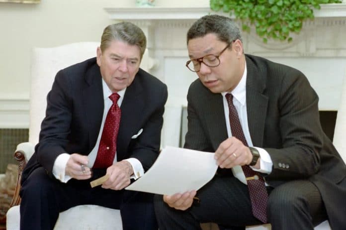 President Ronald Reagan Holds a National Security Council Meeting on The Persian Gulf with National Security Advisor Colin Powell in The Oval Office,