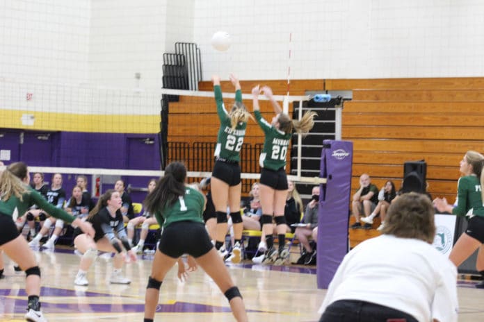 Weeki Wachee's No. 22 Dylan Elferdink and No. 20 Allora Murray defend the net on Oct. 21, 2021 in the district championship against Nature Coast Tech.