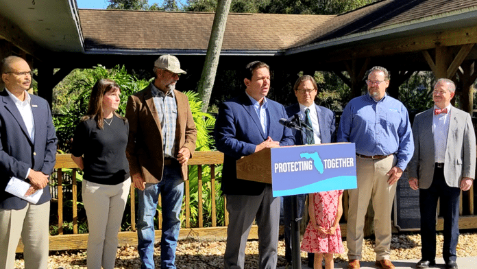 (L to R) DEP Secretary Shawn Hamilton, Kelly Ralston (Northwest Water Management District), Captain C.A. Richardson (Captains for Clean Water), Governor Ron DeSantis, DEP Chief Science Officer Mark Rains, Brian Armstrong (Southwest Florida Water Management District), John Mitten (Southwest Florida Water Management District)