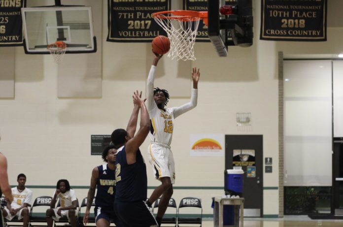 PHSC Point Guard Marcellus Thomas, freshman from Lakeland, Fla takes a shot on Hillsborough. Photo courtesy of PHSC Athletics