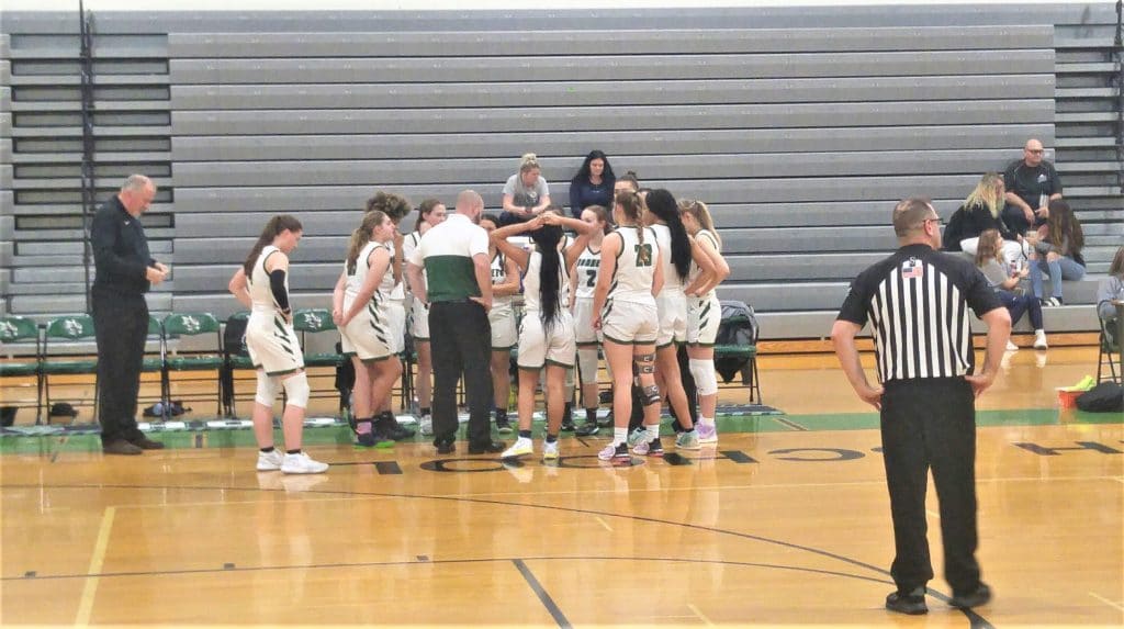 Hornets regroup during a time out in the region quarterfinal against Lakewood Thurs. Feb. 10, 2022.