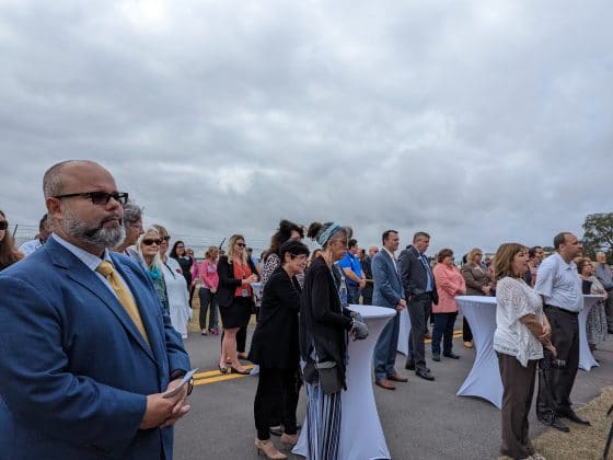 Daniel Abou-Jaoude, Vice President of Skanska Corporation, right and community members