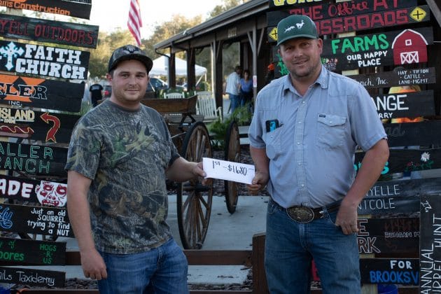 Winners of the 2nd Annual Brooksville Squirrel Hunt, Dillon Pinkston and Shannon Brass, receive their $1,680 prize.