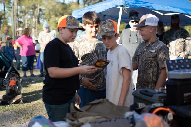 Young squirrel hunters checking out some of the top prizes for the youth competitors of the hunt.