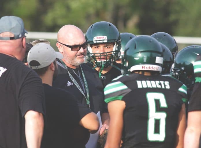 Weeki Wachee football coach Chris Cook talks with his team before the preseason kick-off against Sunlake on Friday night August 20 at Weeki Wachee High School. Photo by Alice Mary Herden