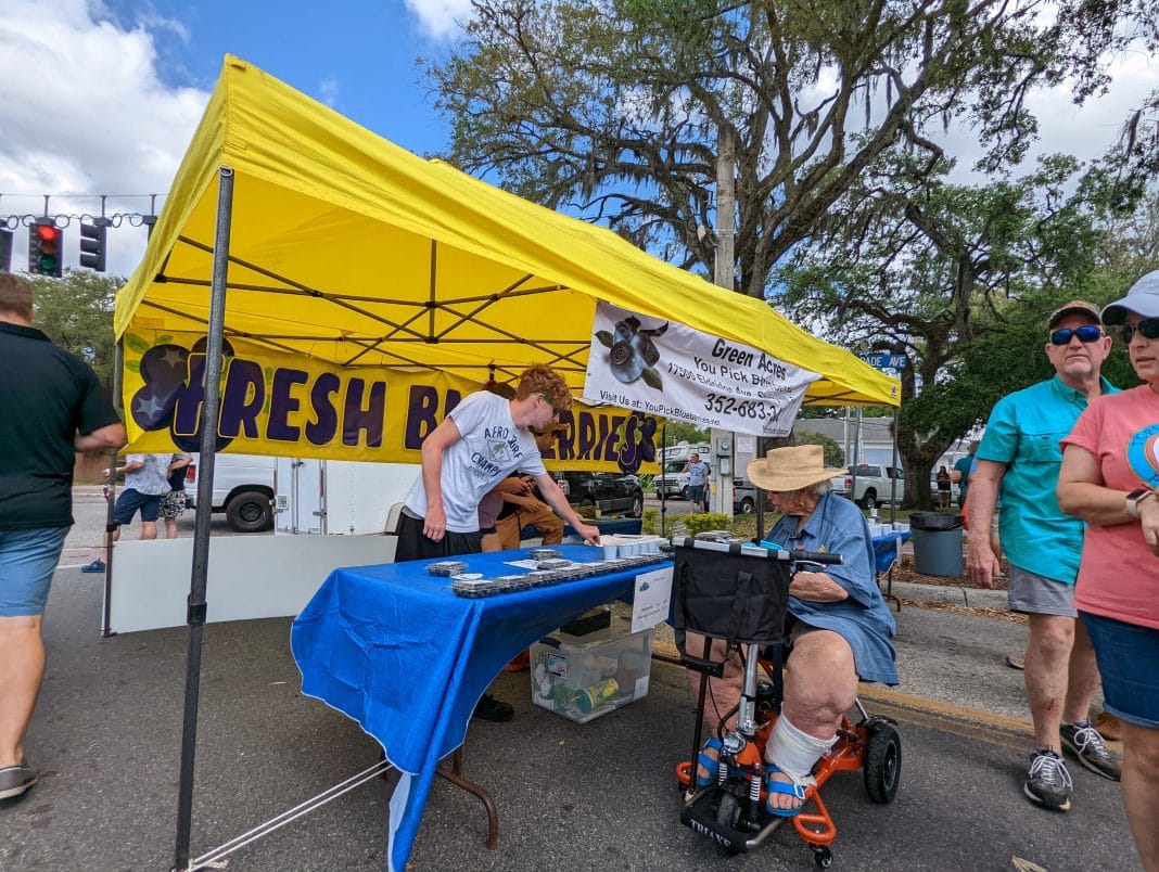 Green Acres setup at Fort Dade Ave and Main Street selling fresh blueberries.