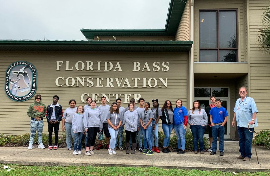 Mr. Royce Green and his Discovery students on a field trip to the Florida Bass Conservation Center two years ago. These students finished their senior year in 2022.