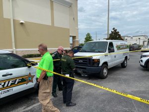 Deputies and forensic investigators on the scene of an unknown manner of death in the parking lot of Aldi on Wendy Ct., Spring Hil, FL. Photo by Patrick Hramika