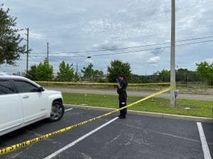 Deputies and forensic investigators on the scene of an unknown manner of death in the parking lot of Aldi on Wendy Ct., Spring Hill, FL. Photo by Patrick Hramika
