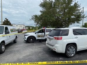 Deputies and forensic investigators on the scene of an unknown manner of death in the parking lot of Aldi on Wendy Ct., Spring Hill, FL. Photo by Patrick Hramika