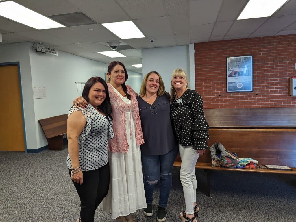 Tina Kinney, NAMI Hernando Executive Director, Angelica, Melissa and Tracey Batchelder Peer Support Supervisor, NAMI Hernando after drug court graduation. Photo by Julie Maglio.