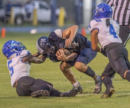 Central High, 14, Braden Joyner is pulled down by a “horse collar tackle” by Anclote High’s ,5, Damien Spencer. Photo by JOE DiCRISTOFALO