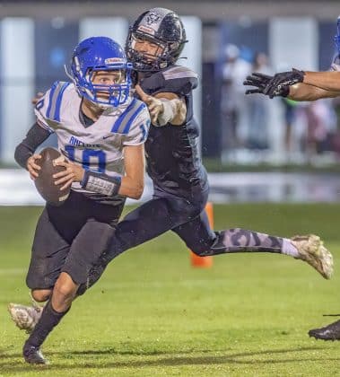 Central High, 7, Caden Bergantino puts the pressure on Anclote QB ,10, Paul Fousek. Photo by JOE DiCRISTOFALO