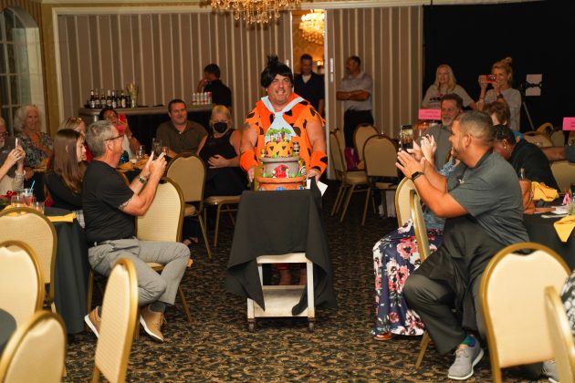 Richard Sanvenero aka Fred Flintstone presents his cake. Photo by Monocle Design Solutions.