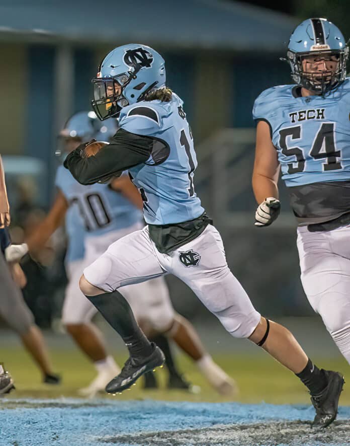 NCT defender ,13, Brady Nowlin runs back an intercepted pass setting up a Nature Coast touchdown against Central High during the Sharks' Homecoming game. Photo by JOE DiCRISTOFALO